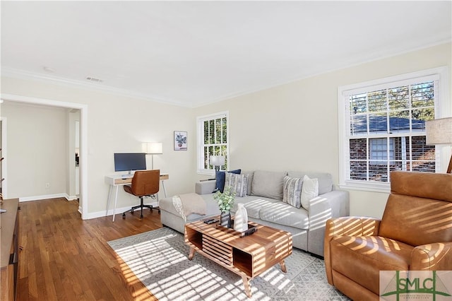 living room featuring light wood-type flooring and crown molding