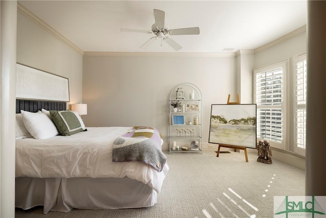 carpeted bedroom featuring ceiling fan and ornamental molding