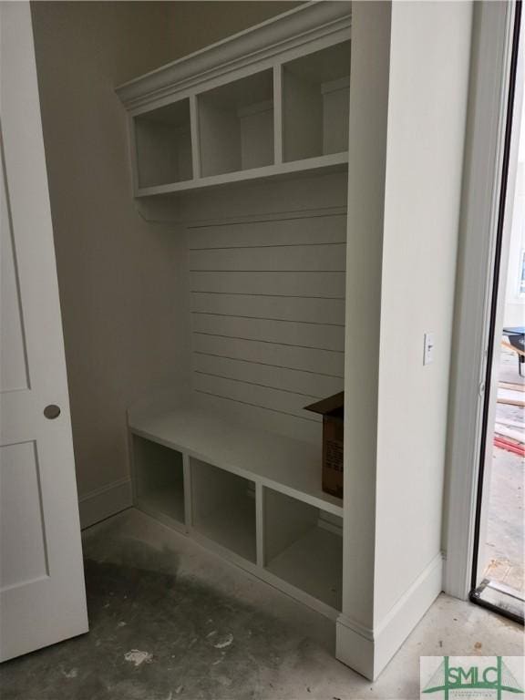 mudroom with concrete flooring