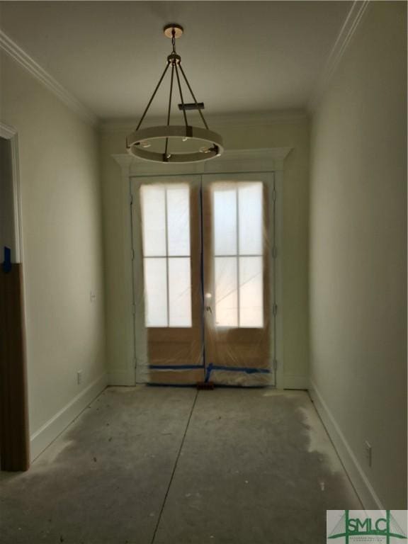 unfurnished dining area featuring french doors and crown molding