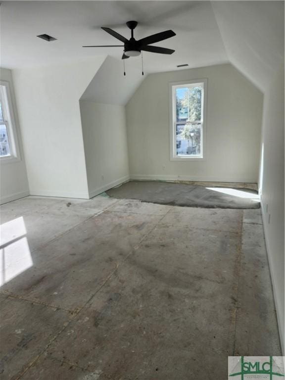 bonus room with ceiling fan and lofted ceiling