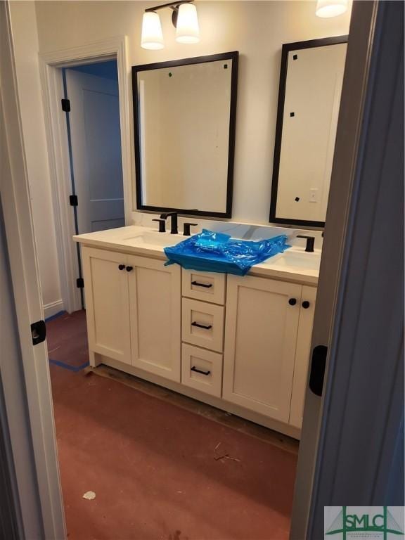 full bathroom featuring a sink and double vanity