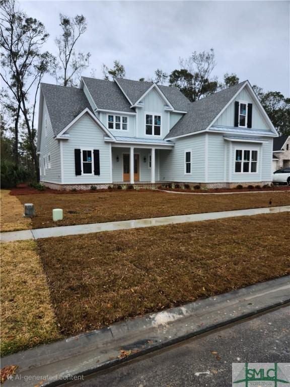 view of front of house featuring a porch and a front lawn