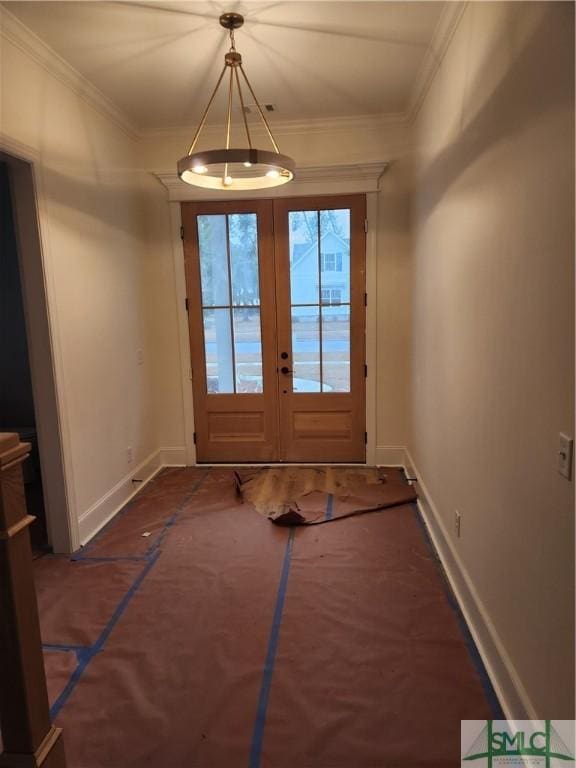 entryway featuring ornamental molding and baseboards