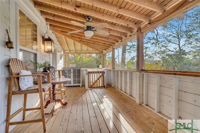 wooden terrace featuring ceiling fan