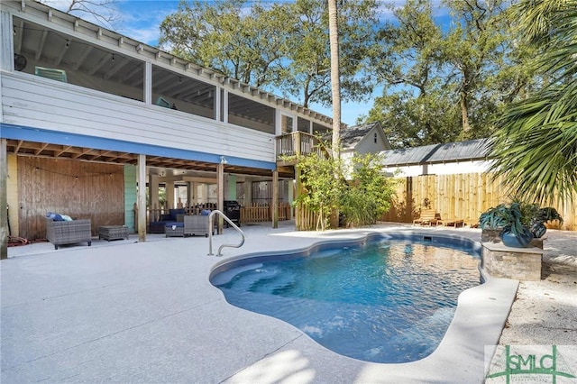 view of swimming pool with outdoor lounge area and a patio area