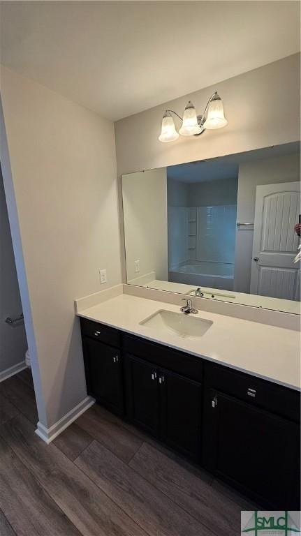 bathroom with vanity and hardwood / wood-style flooring