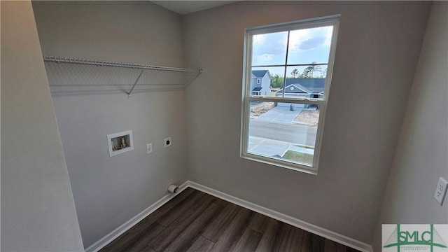 washroom featuring hookup for an electric dryer, dark hardwood / wood-style flooring, and washer hookup