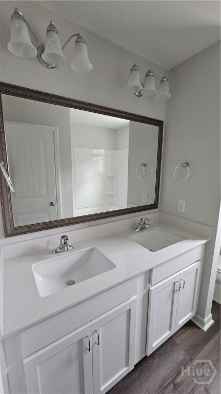 150 Cross Creek Dr, Pooler, GA 31322 - full bathroom with double vanity and wood finished floors