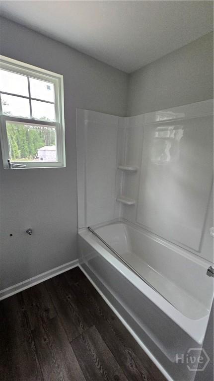 150 Cross Creek Dr, Pooler, GA 31322 - bathroom featuring wood finished floors, baseboards, and washtub / shower combination
