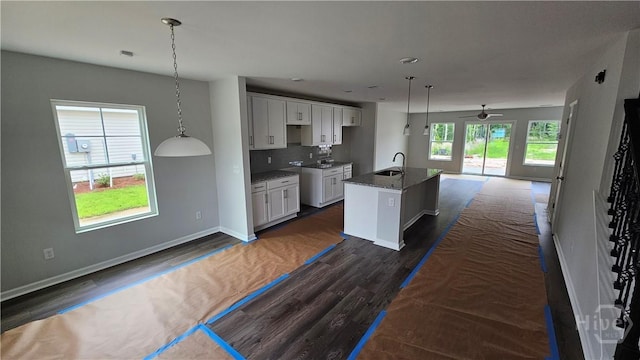 150 Cross Creek Dr, Pooler, GA 31322 - kitchen featuring a sink, open floor plan, a ceiling fan, a center island with sink, and dark wood-style floors