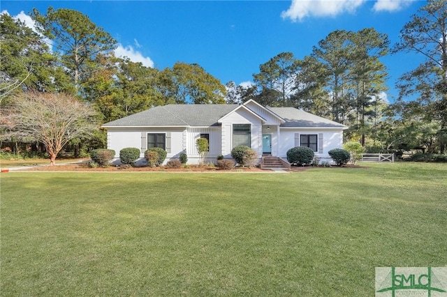 single story home with a front lawn and fence