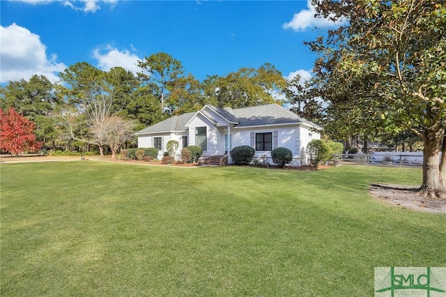 ranch-style home featuring a front yard