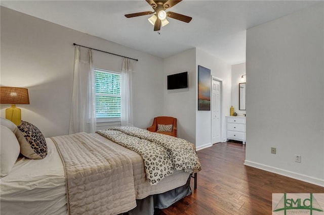 bedroom featuring dark wood finished floors, a ceiling fan, and baseboards