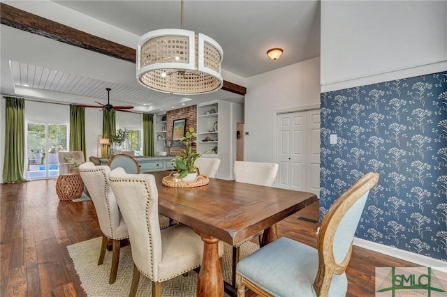 dining room featuring ceiling fan, wallpapered walls, baseboards, and wood finished floors