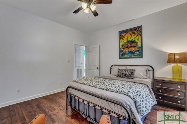 bedroom featuring a ceiling fan, baseboards, and wood finished floors