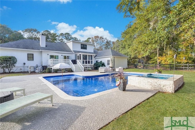 outdoor pool featuring fence, a yard, a deck, an in ground hot tub, and a patio