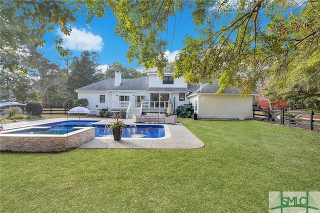 rear view of property featuring a lawn, a jacuzzi, a fenced backyard, an outdoor pool, and a chimney