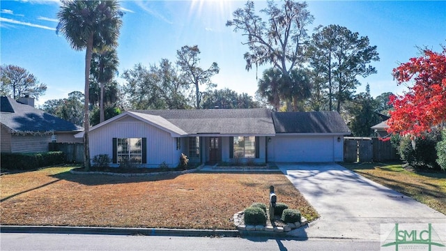 ranch-style house with a front yard and a garage