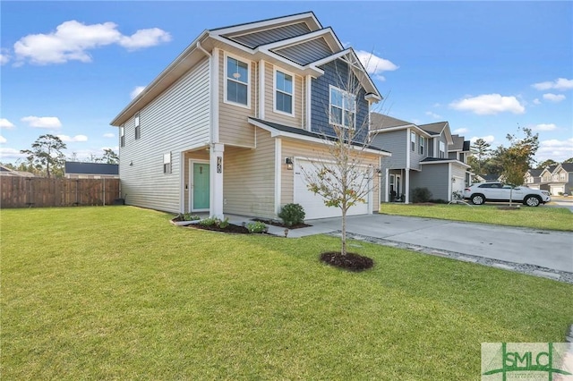 view of front of home featuring a front yard and a garage