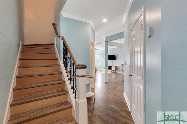 stairway featuring wood-type flooring and ornamental molding