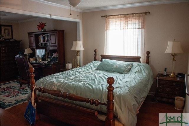 bedroom featuring dark hardwood / wood-style flooring and crown molding