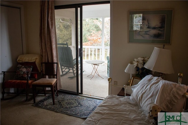 doorway to outside featuring carpet flooring