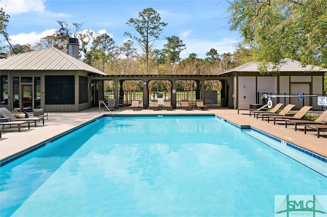 view of pool featuring a sunroom