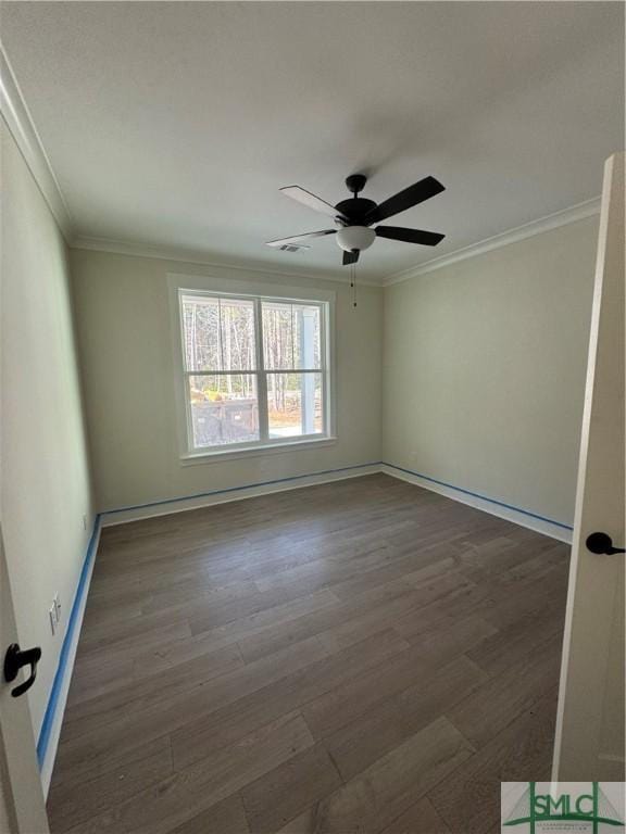 unfurnished room featuring ornamental molding, dark hardwood / wood-style floors, and ceiling fan