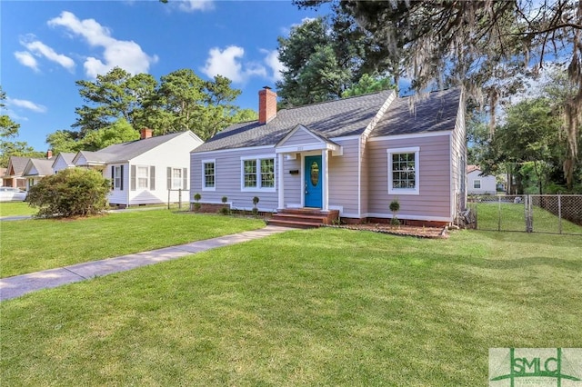 ranch-style home featuring a front lawn