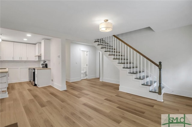 unfurnished living room with light hardwood / wood-style floors