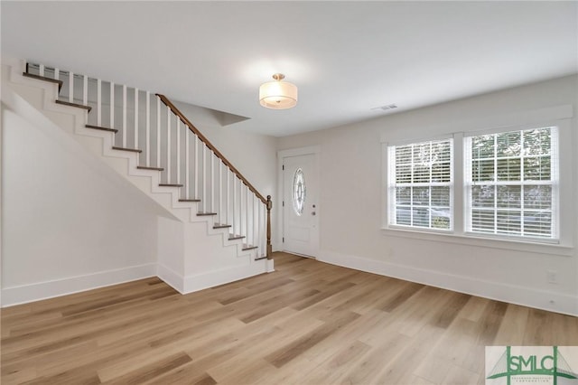 foyer with light hardwood / wood-style floors