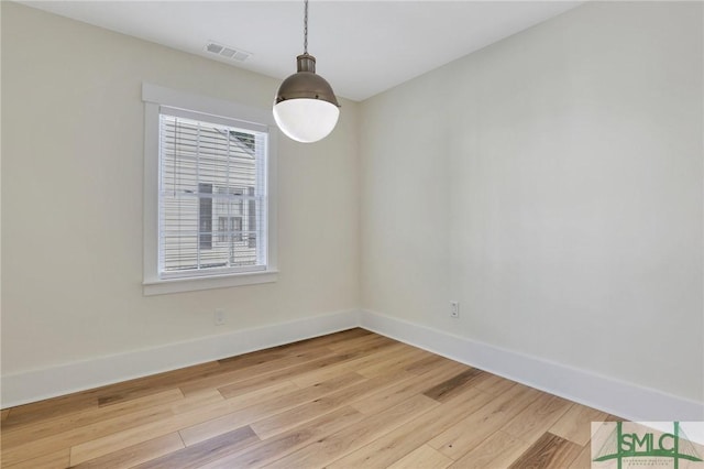 spare room featuring hardwood / wood-style floors