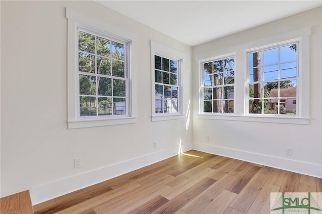 spare room featuring light wood-type flooring