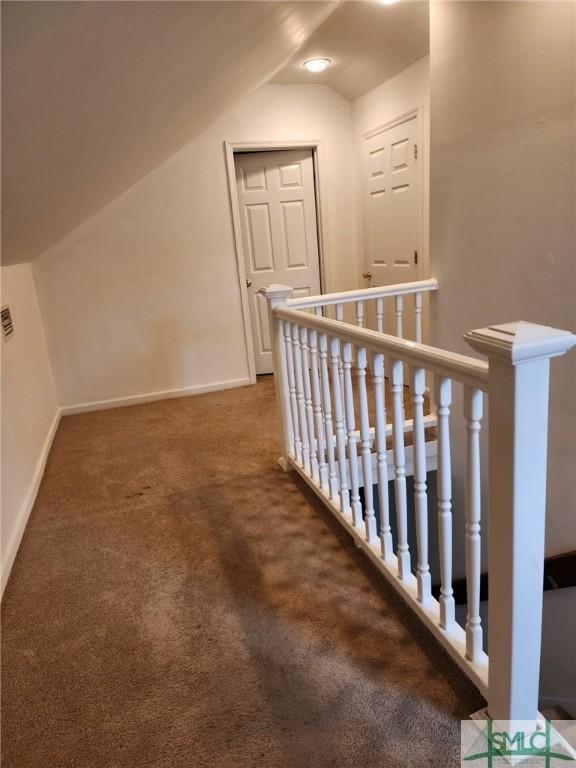 bonus room featuring carpet floors and vaulted ceiling