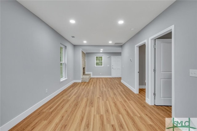 unfurnished living room featuring light hardwood / wood-style floors