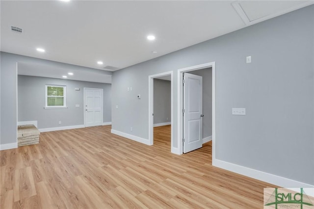 unfurnished living room featuring light hardwood / wood-style floors