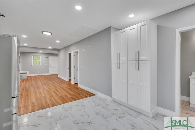 interior space with stainless steel refrigerator and light wood-type flooring