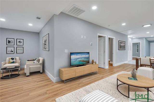 living room with light hardwood / wood-style flooring