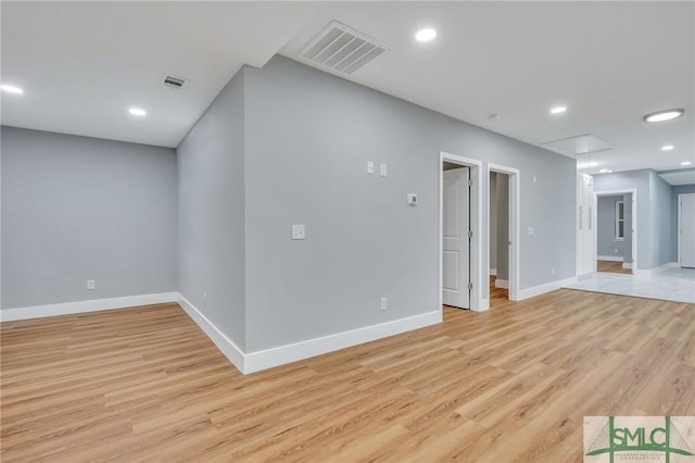 empty room with light hardwood / wood-style floors