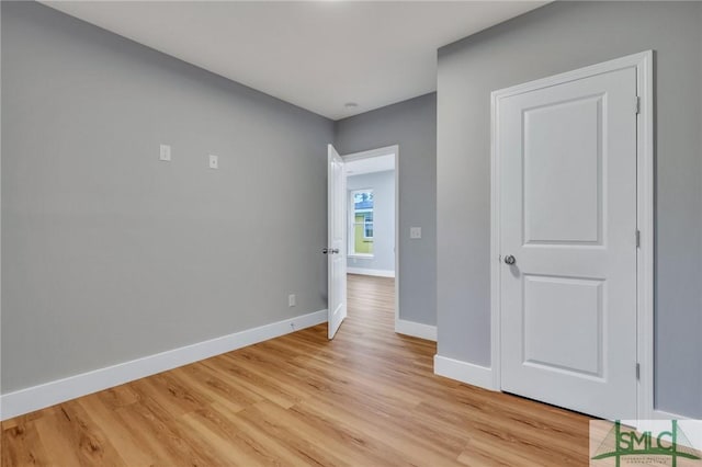 unfurnished room with light hardwood / wood-style flooring