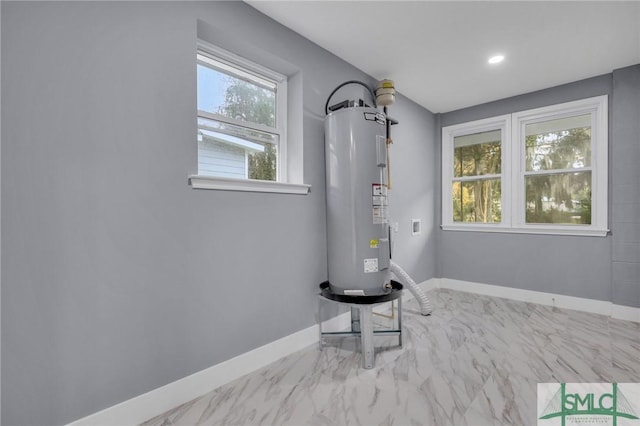 utility room with electric water heater