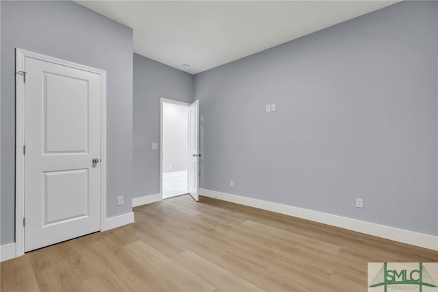 unfurnished bedroom with light wood-type flooring