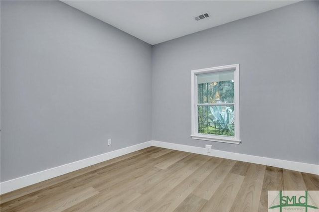 spare room featuring light hardwood / wood-style floors