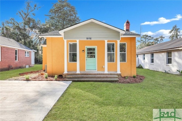 bungalow with a front yard