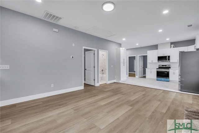 unfurnished living room featuring light hardwood / wood-style flooring