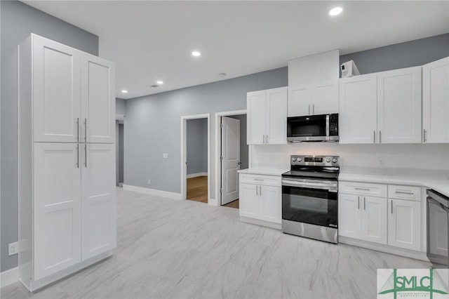 kitchen with white cabinets and appliances with stainless steel finishes