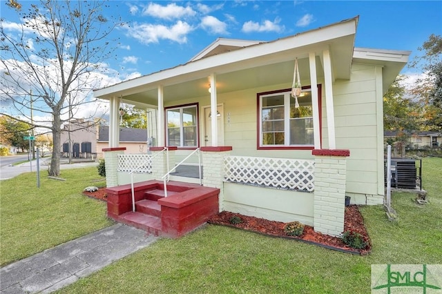 view of front of house with a front lawn and a porch