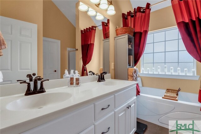 bathroom featuring tile patterned floors, vanity, independent shower and bath, and vaulted ceiling