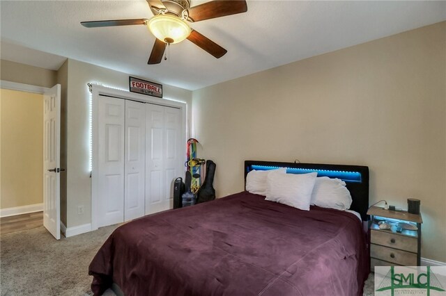 bedroom with ceiling fan, a closet, and carpet